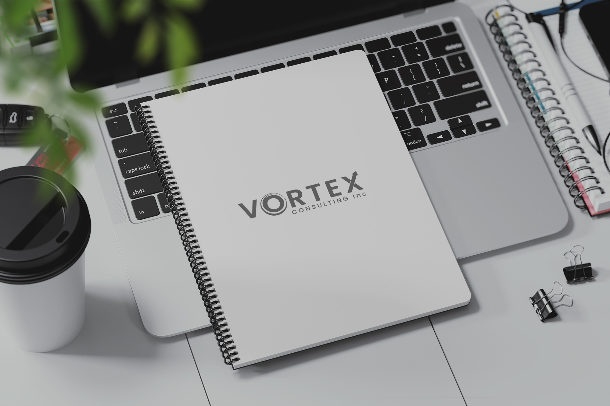 Vortex Consulting logo on spiral notebook