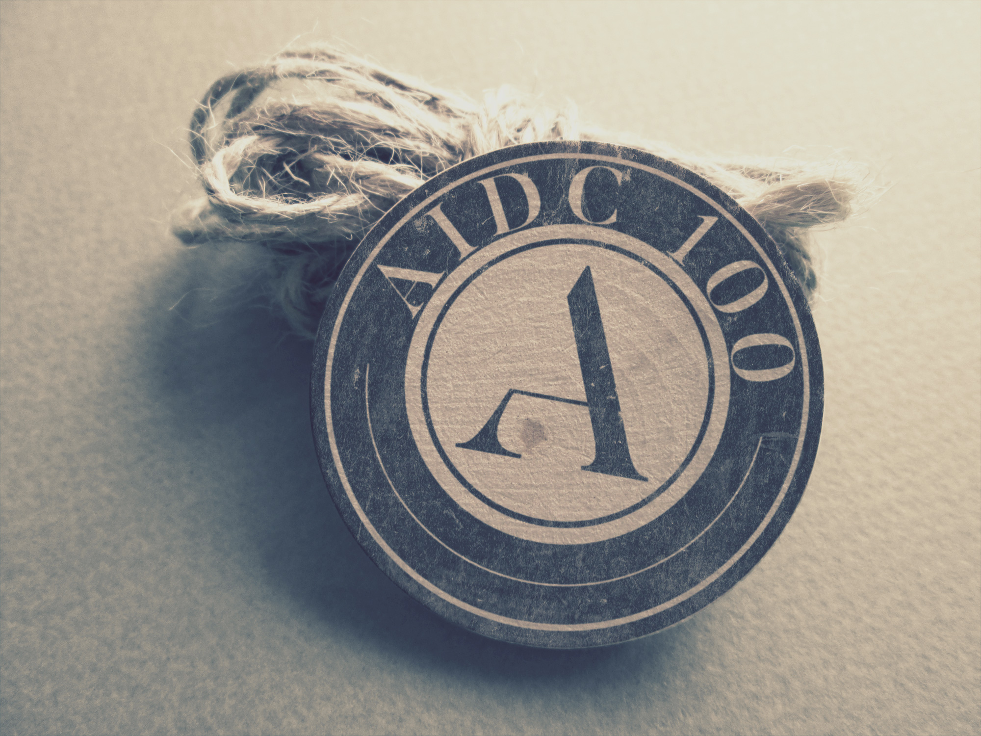AIDC 100 logo in vintage style mockup