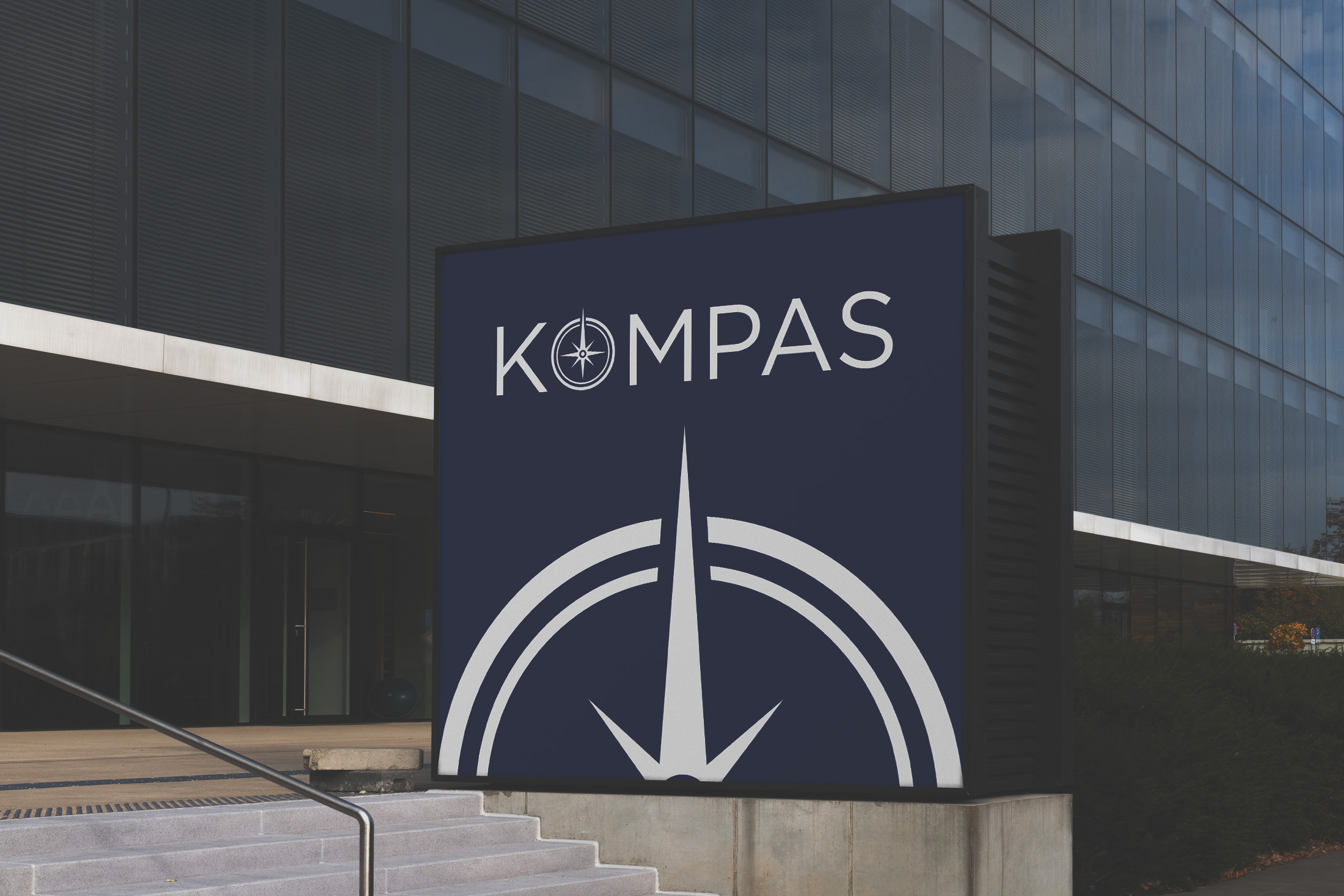 Kompass rebranding logo on large billboard mockup