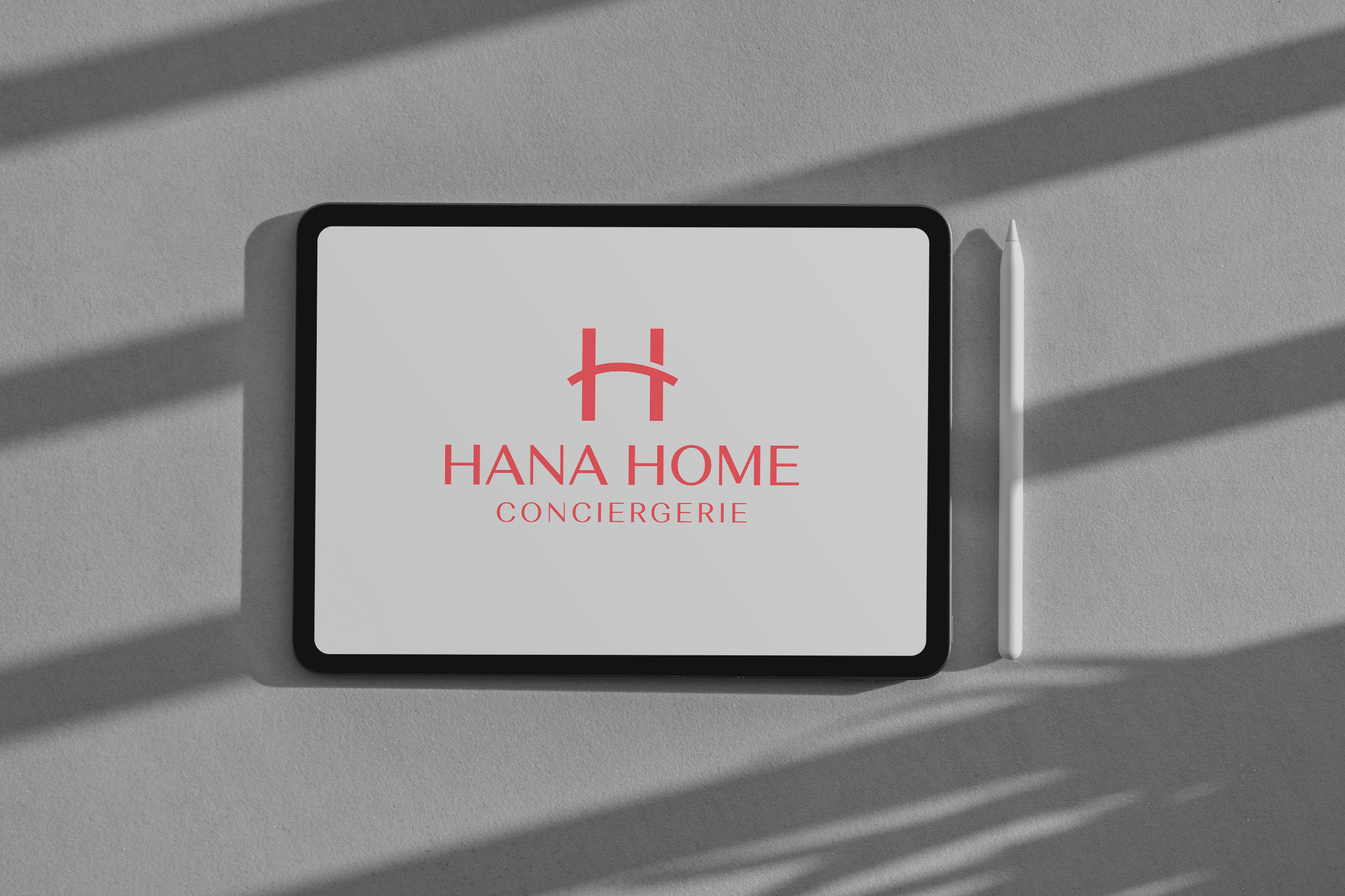 Hana Home Conciergerie logo displayed on iPad