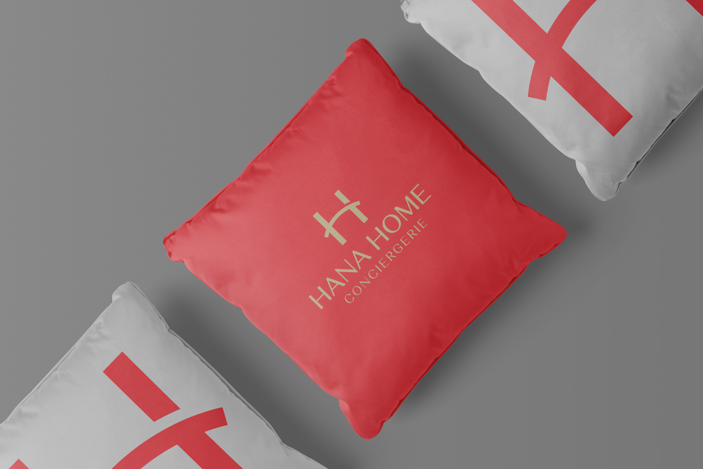 Hana Home Conciergerie logo on cushion